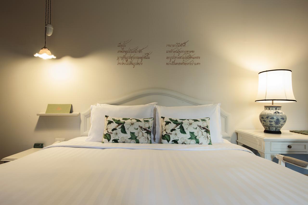 فندق ذا راوييكانلايا بانكوك المظهر الخارجي الصورة A bedroom at the Inn